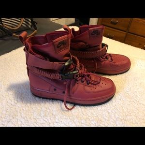 Real leather red/black Nike high tops. There super comfy